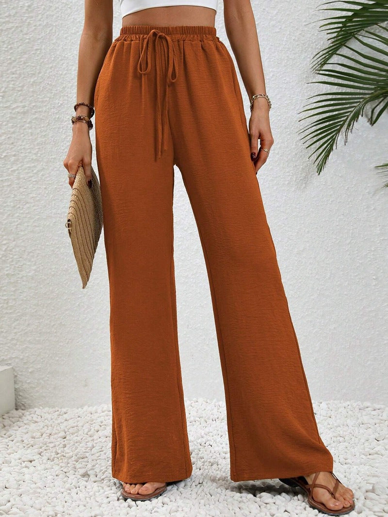 Women's casual, wide-legged leisure trousers with elasticated waistband and side pockets, size S