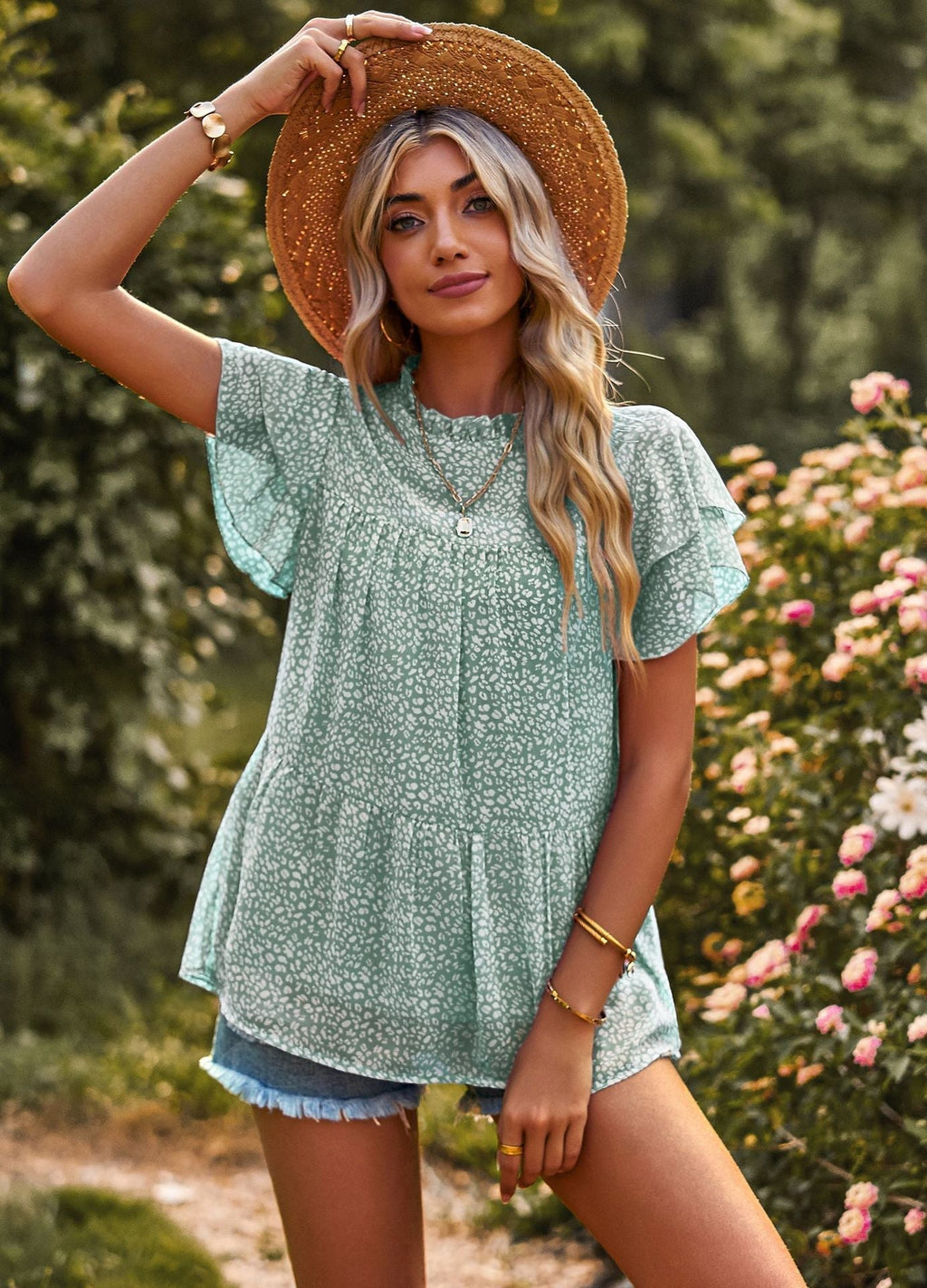 Women's flowy blouse with ruffle details and floral design, size