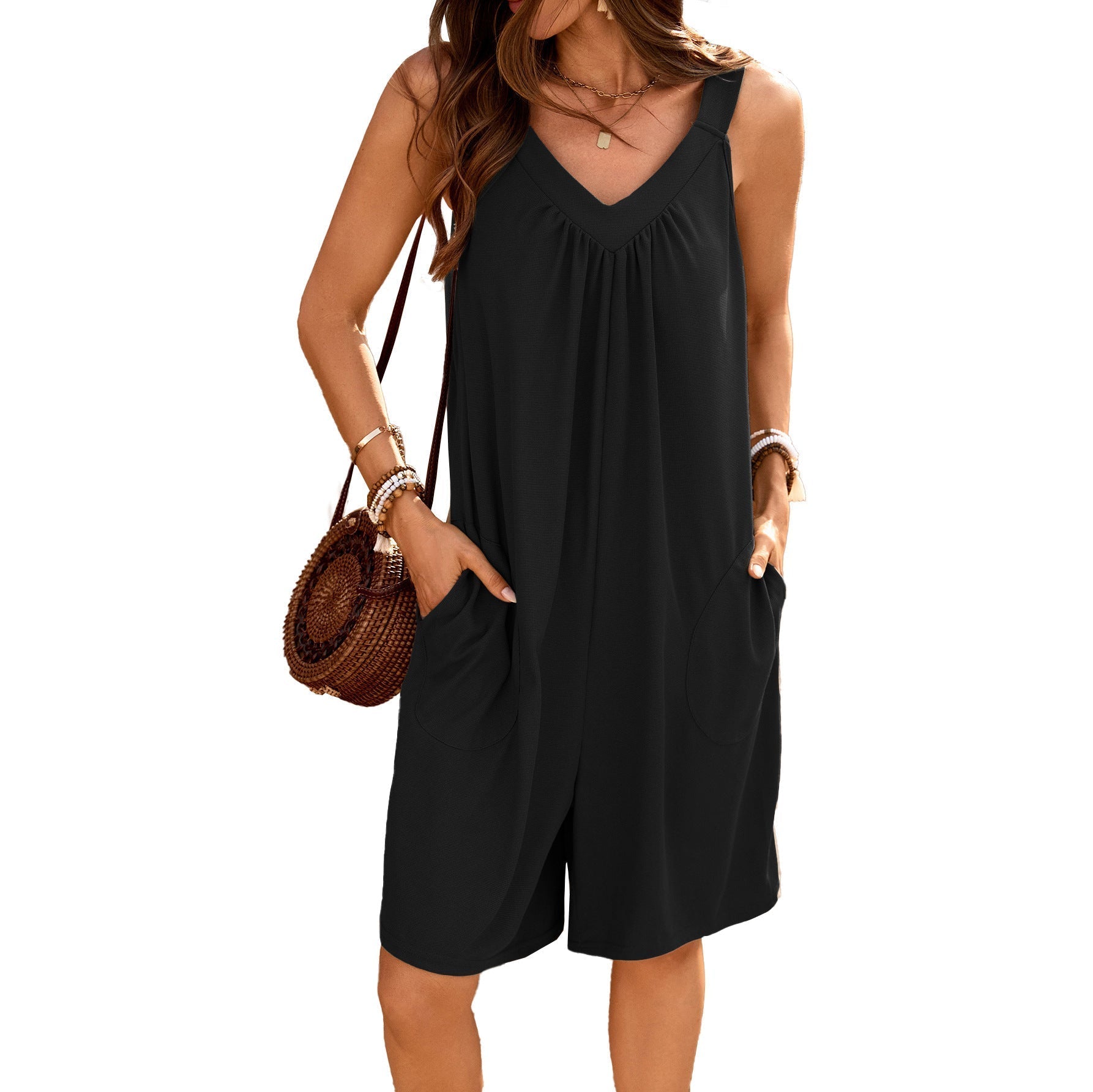Women's sleeveless jumpsuit with deep V-neck and practical pockets, size S
