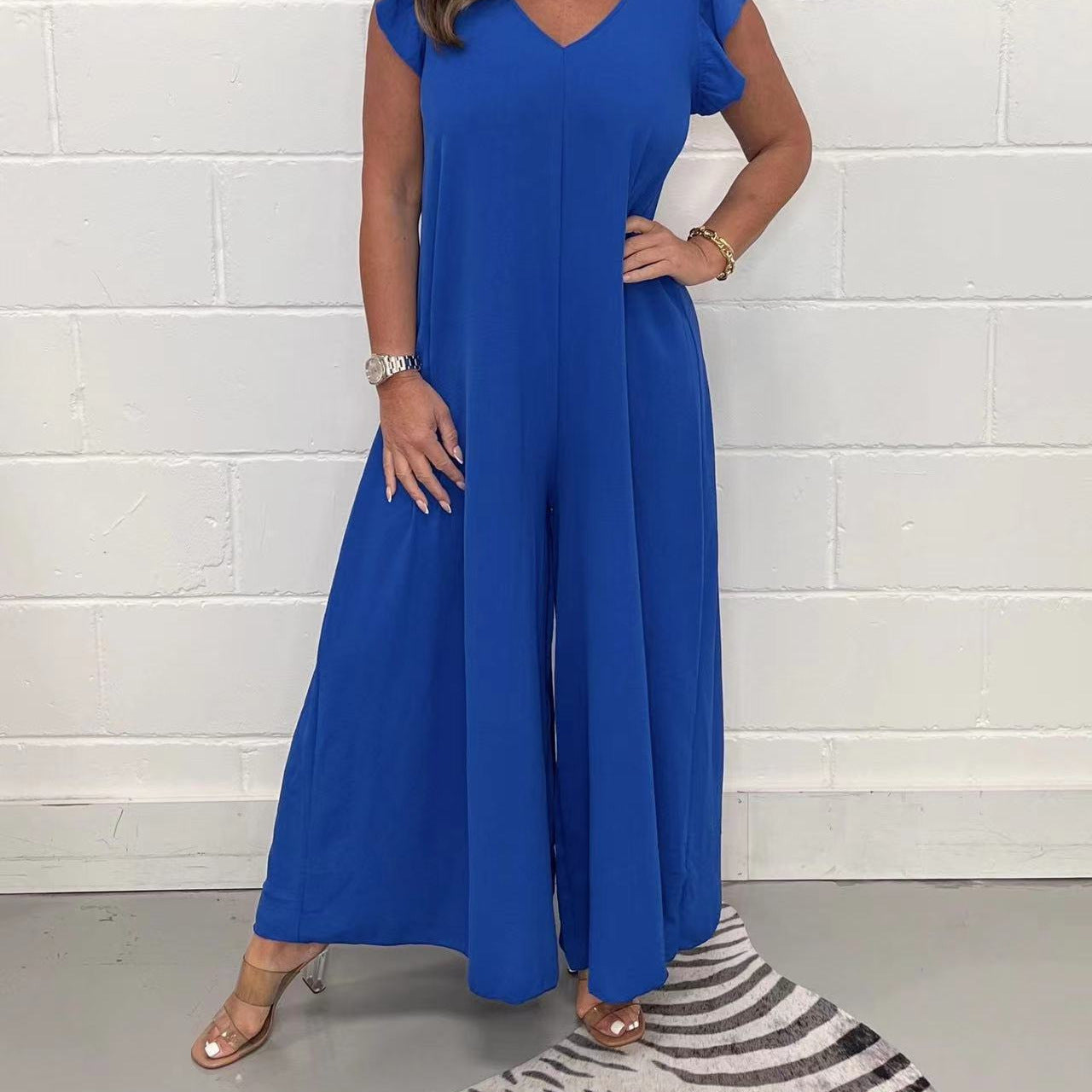 Women's upscale jumpsuit with voluminous ruffled sleeves and V-neck, size S