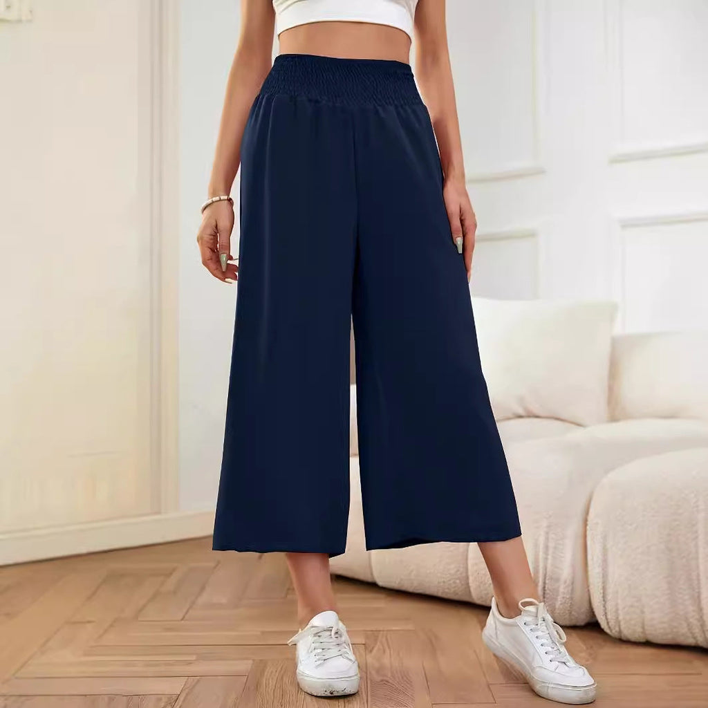 Women's wide-leg, high-waisted palazzo pants with elasticated waistband and flowing material, size S