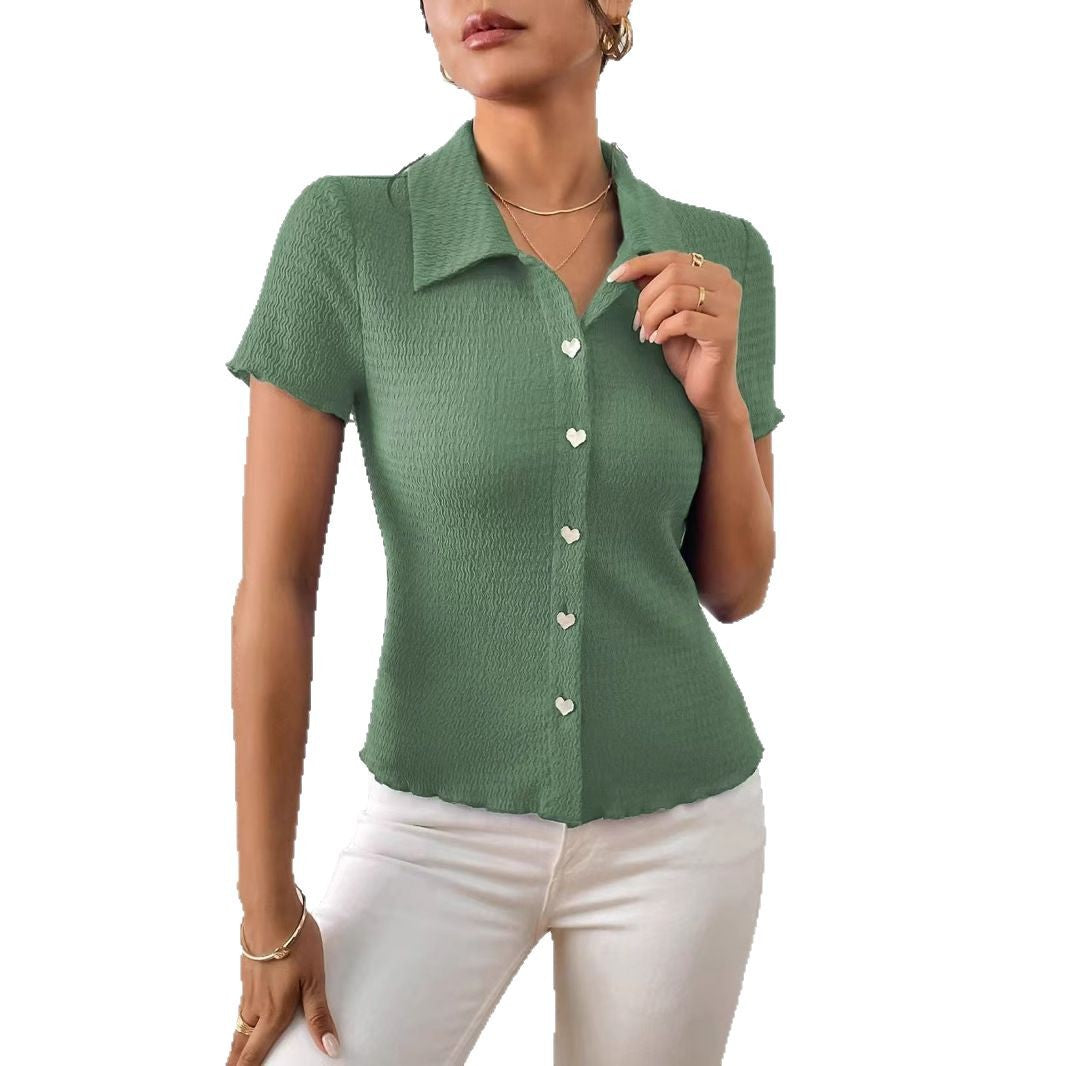 Women's short-sleeved blouse with a structured design and heart-shaped buttons, size [size missing]