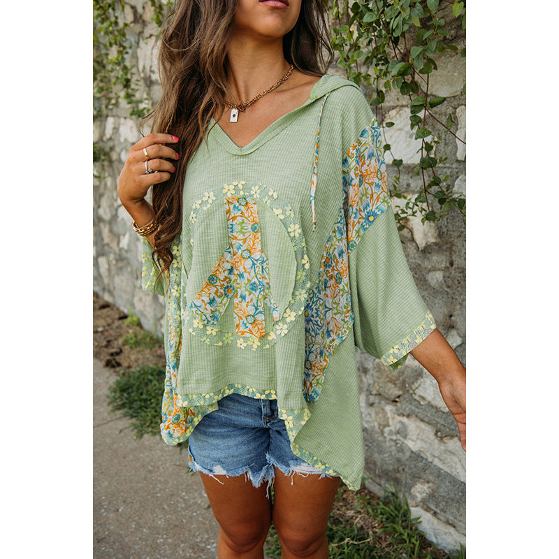 Women's casual hooded top with floral peace design, size S