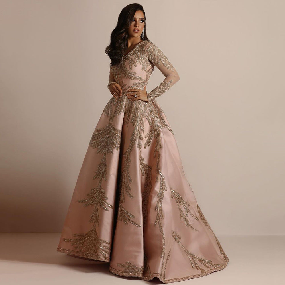Women's glamorous ball gown with delicate sequin embellishment and long cut, size S