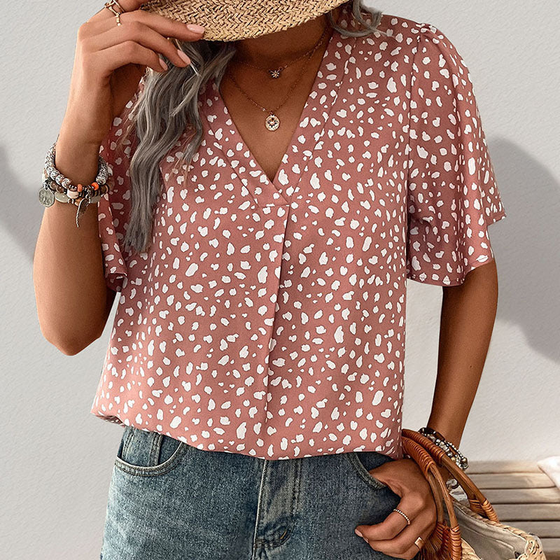 Women's short-sleeved blouse with a modern polka dot design and a relaxed fit, size [size missing]
