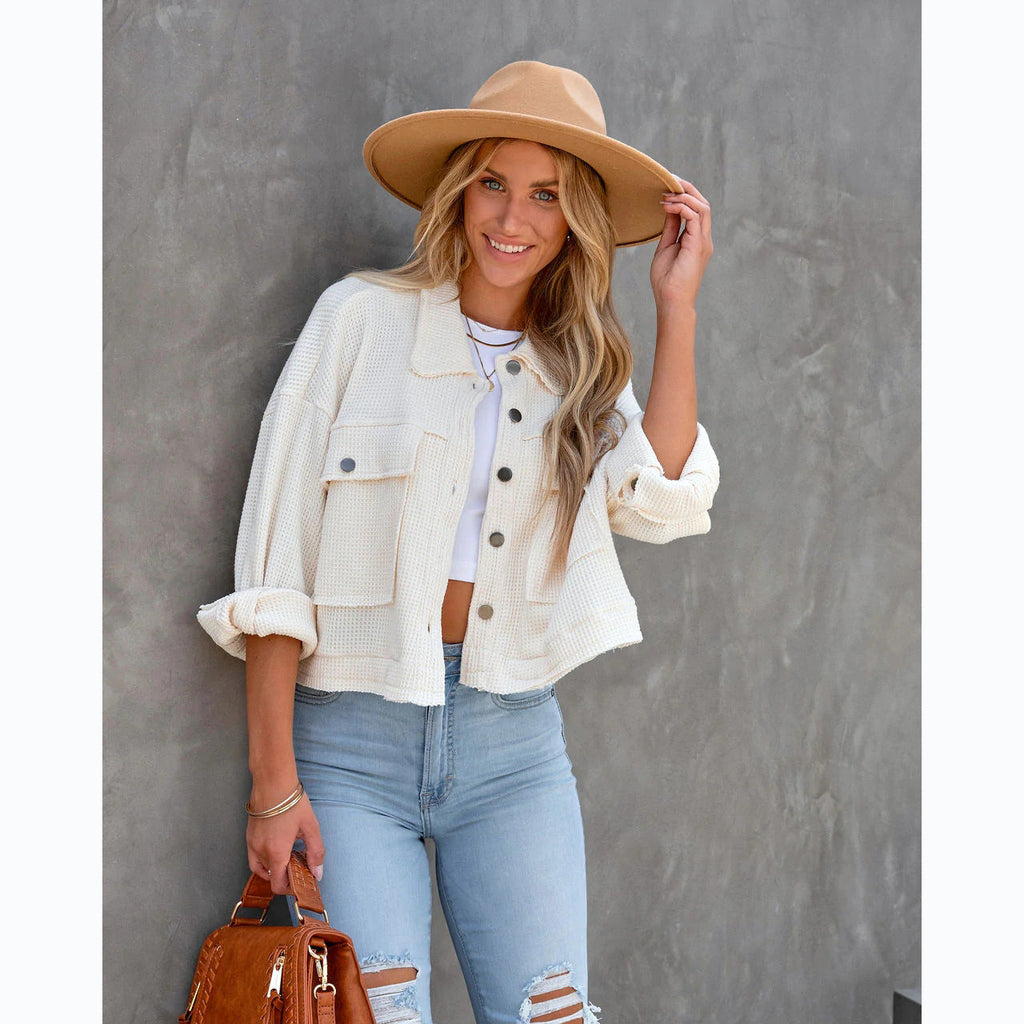 Women's short denim jacket with a casual cut and practical pocket design, size S