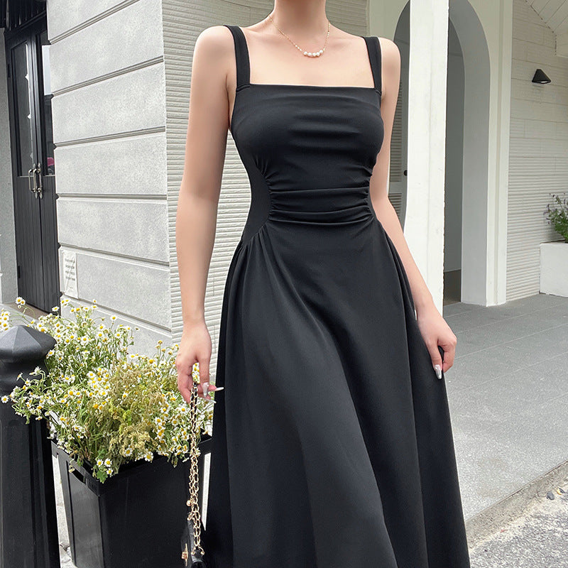 Women's elegant spaghetti strap midi dress with a figure-hugging silhouette and sophisticated draping, size [size]