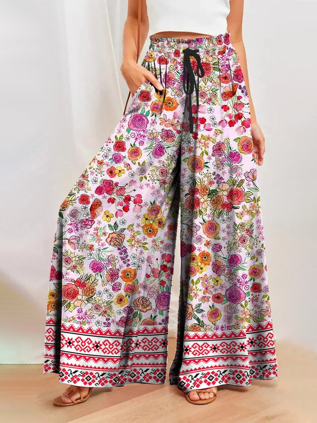 Damenhose mit weitem Bein, Blumenmuster, elastischem Bund und praktischen Taschen, Größe