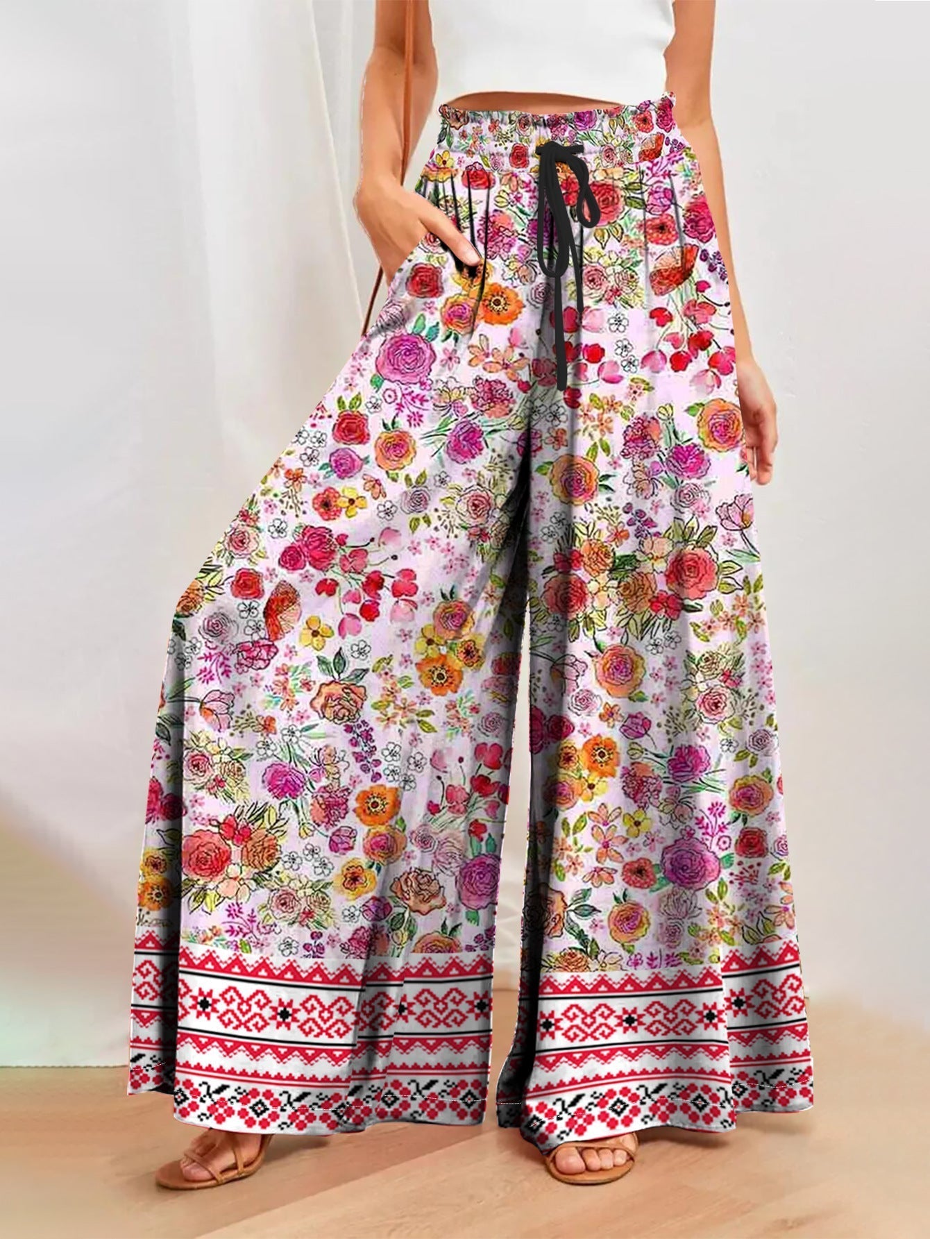 Damenhose mit weitem Bein, Blumenmuster, elastischem Bund und praktischen Taschen, Größe