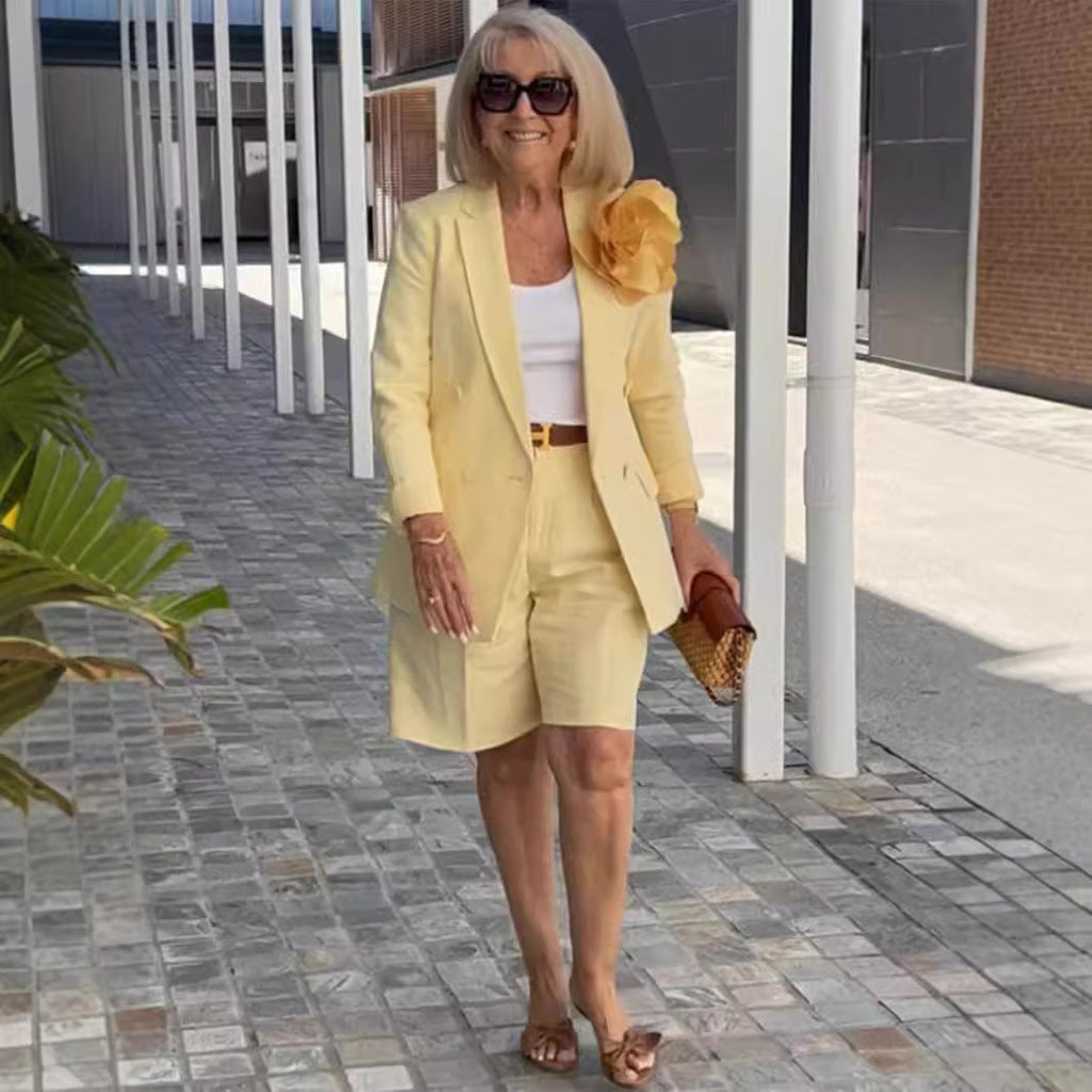 Women's elegant blazer and shorts ensemble with fashionable button detail and high-quality material, size S