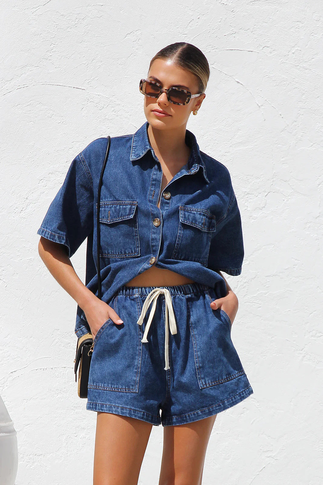 Women's denim crop top and shorts set with practical pockets and a relaxed fit, size S