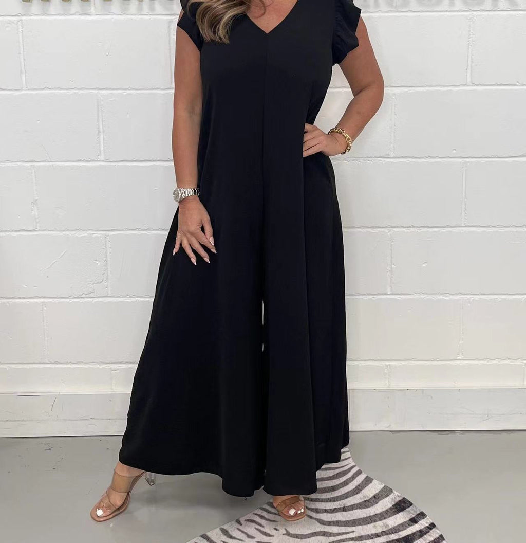 Women's upscale jumpsuit with voluminous ruffled sleeves and V-neck, size S