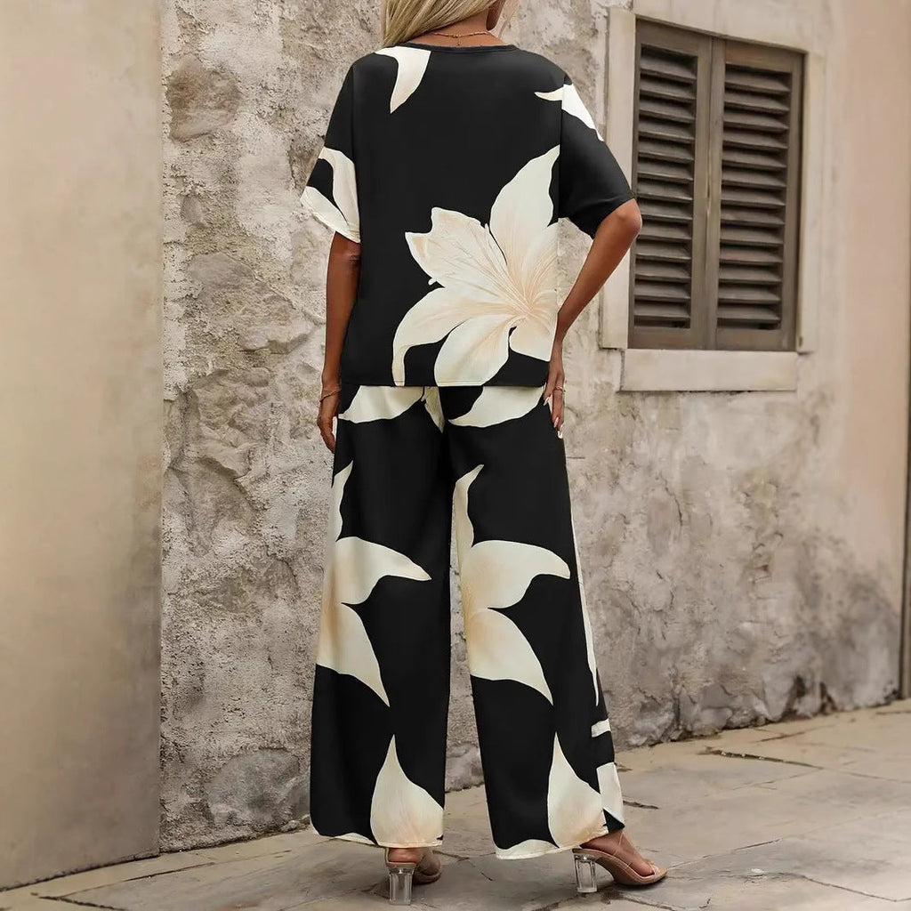 Women's relaxed jumpsuit with floral design and elasticated waistband, size