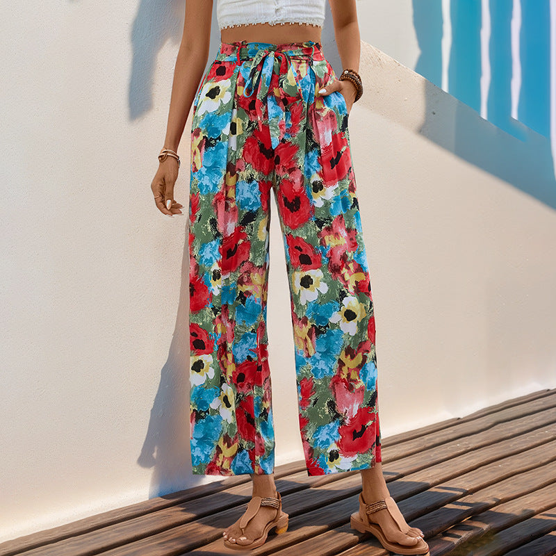 Women's wide-legged summer trousers with a colorful floral pattern and elasticated waistband, size [size missing]