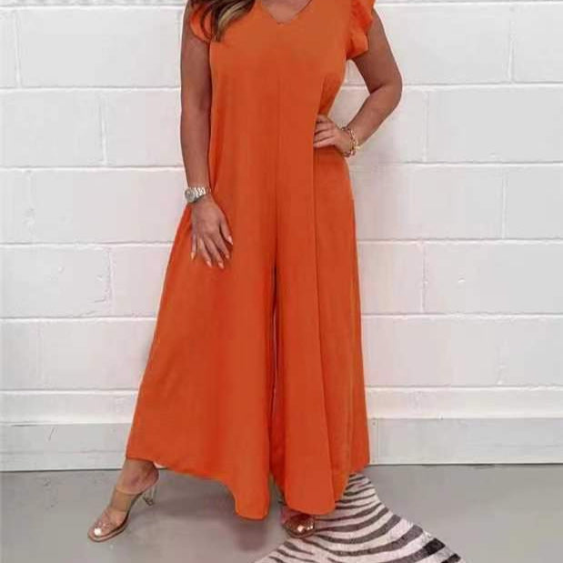Women's upscale jumpsuit with voluminous ruffled sleeves and V-neck, size S