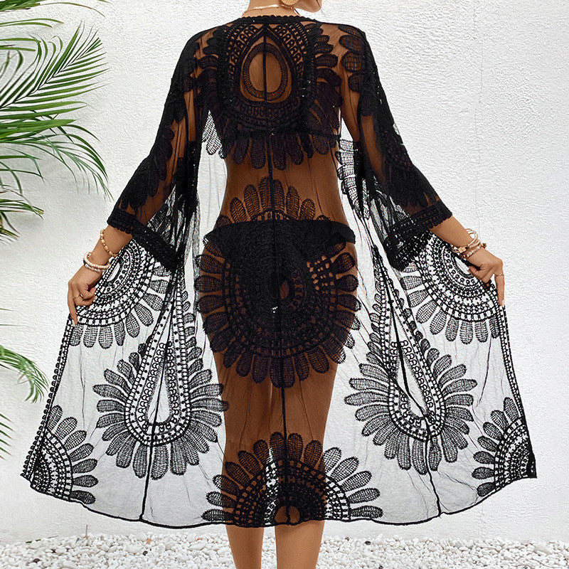 Women's chic crochet beach wrap with voluminous sleeves and elegant design, size S