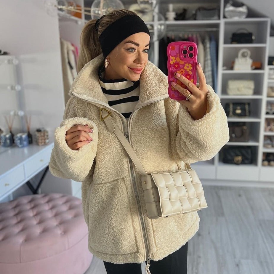 Women's cozy fleece jacket with high collar and practical pockets, size