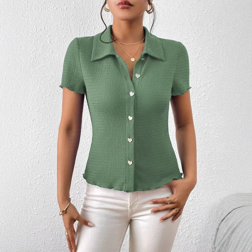 Women's short-sleeved blouse with a structured design and heart-shaped buttons, size [size missing]