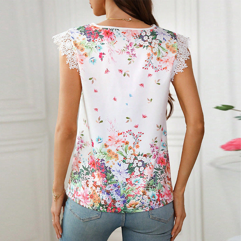 Women's blouse with floral design and elegant lace sleeves, size