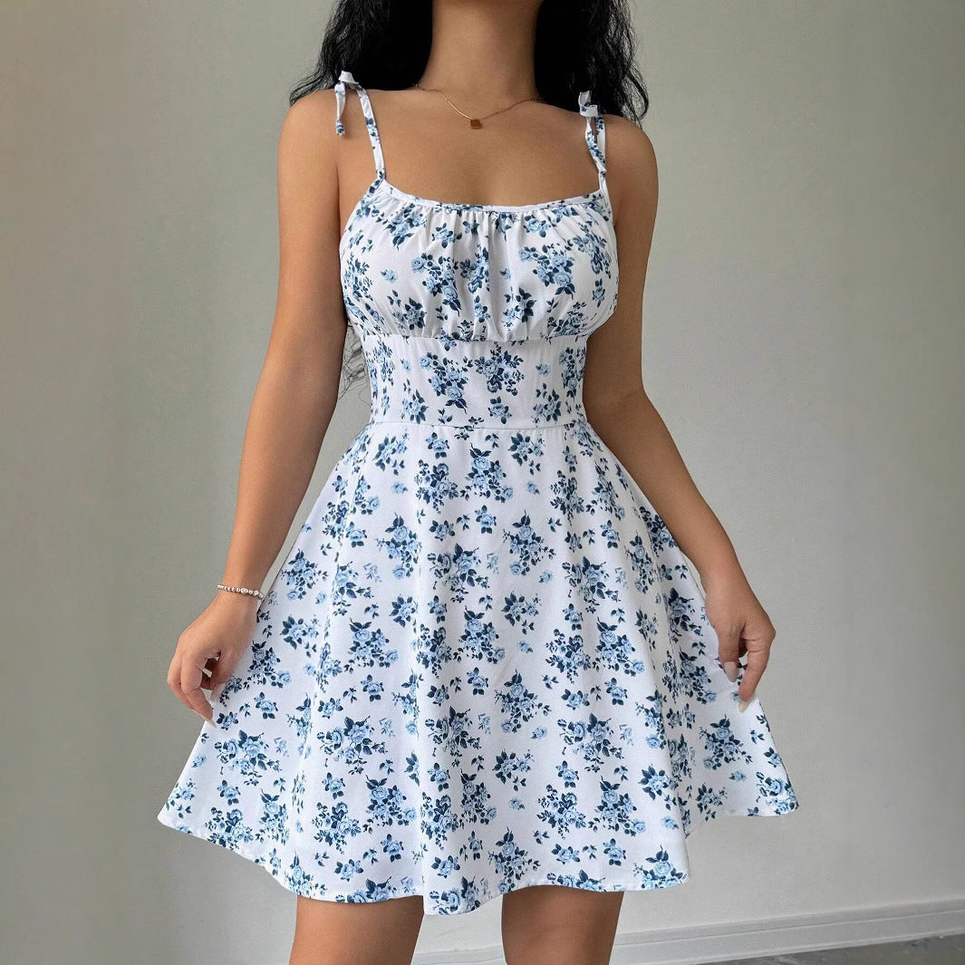 Women's summer dress with adjustable spaghetti straps and floral accents, size [size missing]