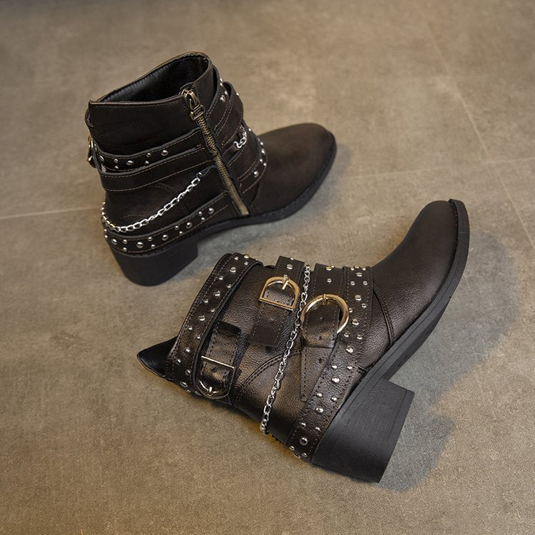 Women's ankle boots with a fashionable strap design and decorative accents, size S