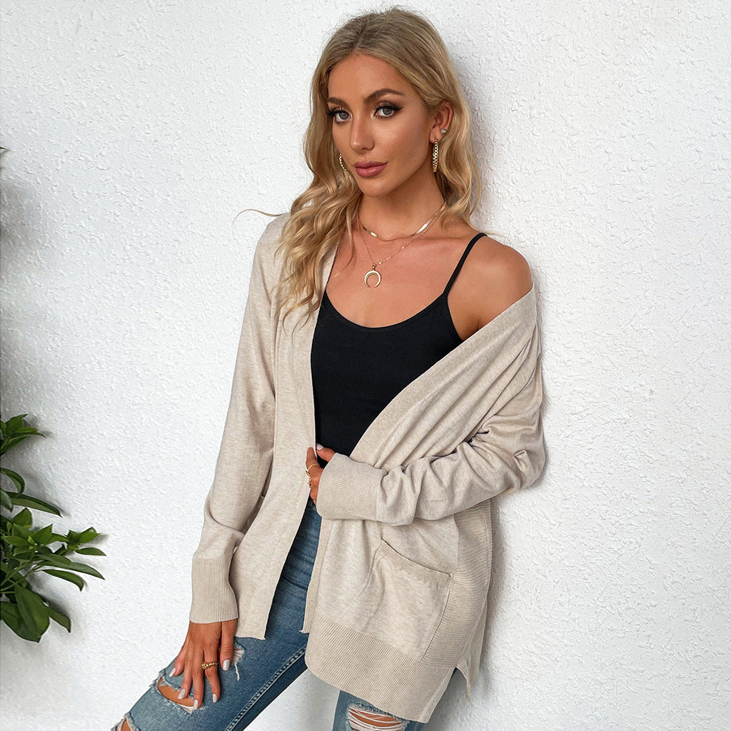 Damen Strickjacke mit tiefem V-Ausschnitt und praktischen Taschen, Größe S