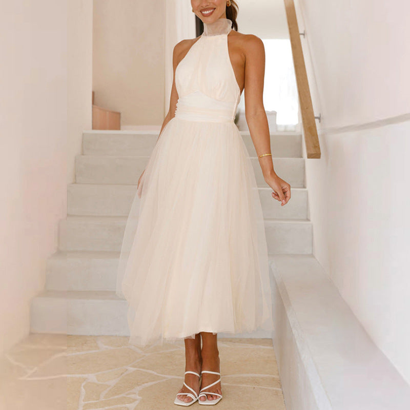 Women's elegant wedding dress with flowing tulle skirt and halter neck design, size S
