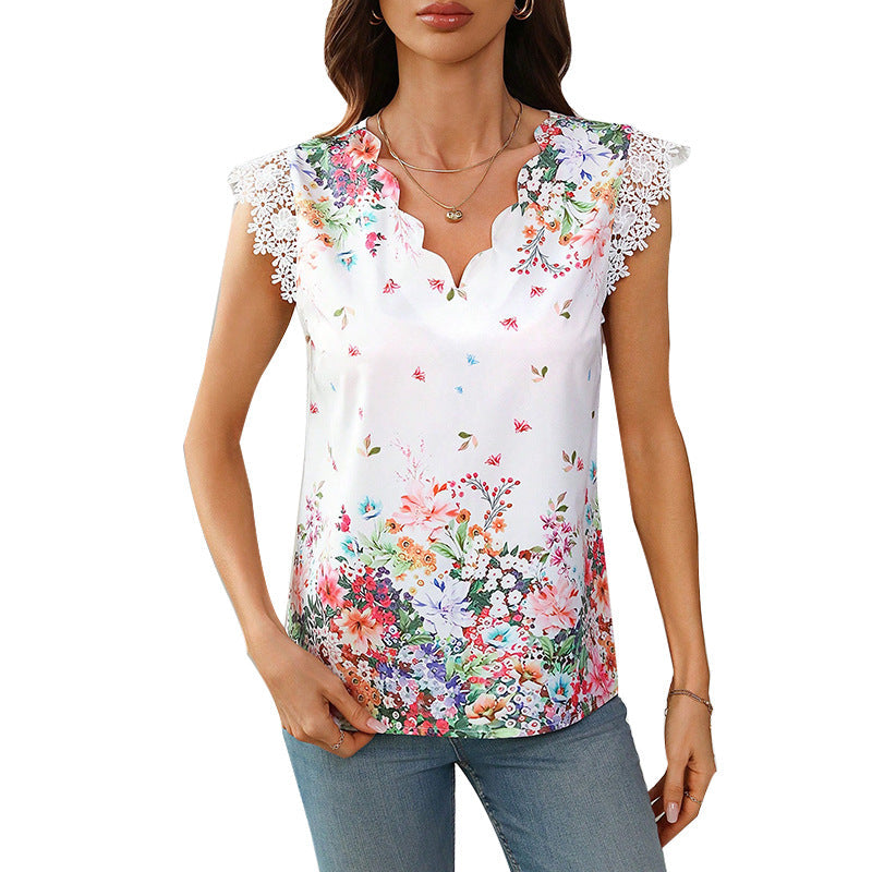 Women's blouse with floral design and elegant lace sleeves, size