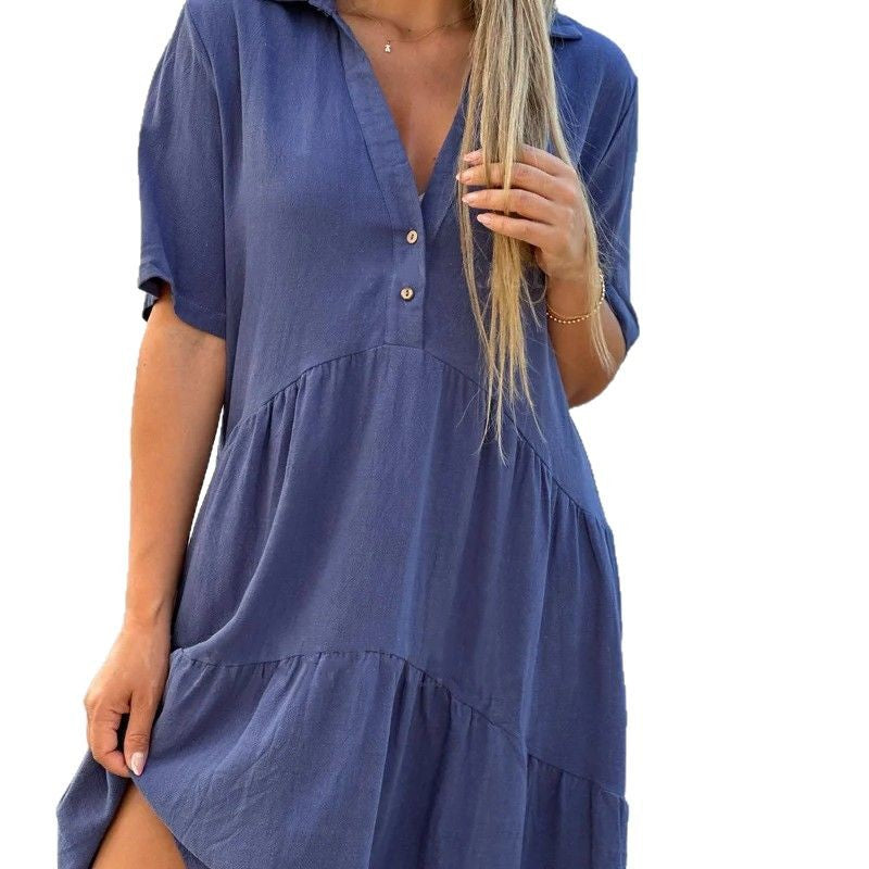 Women's loose-fitting shirt dress with button details and flowing hem, size