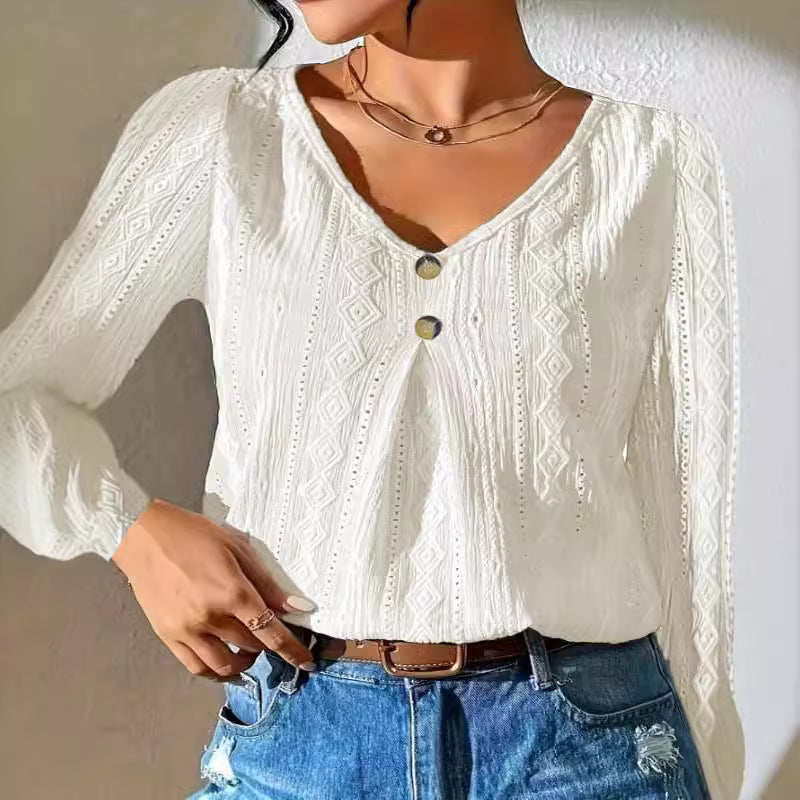 Women's blouse with decorative buttons and textured fabric, size S