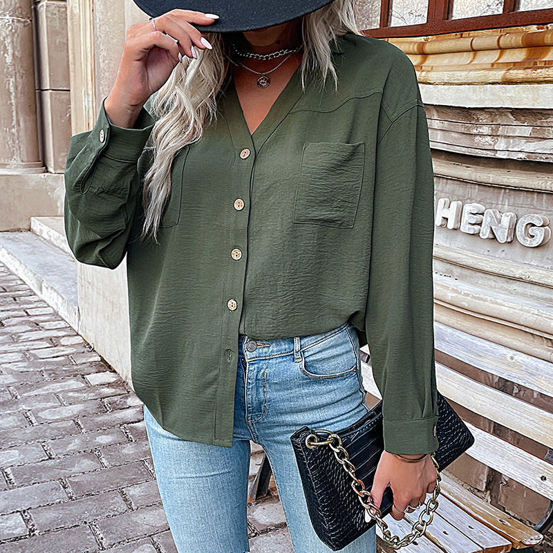 Women's blouse with a relaxed fit and decorative button details, size [size missing]