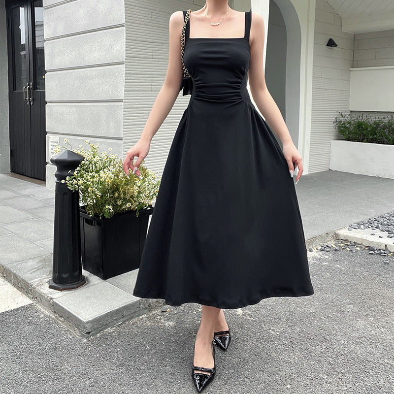 Women's elegant spaghetti strap midi dress with a figure-hugging silhouette and sophisticated draping, size [size]