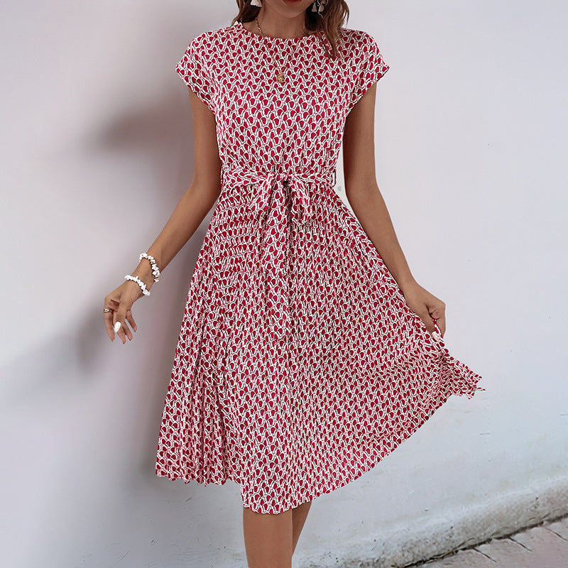 Women's midi dress with a sophisticated waist belt and playful pattern, size