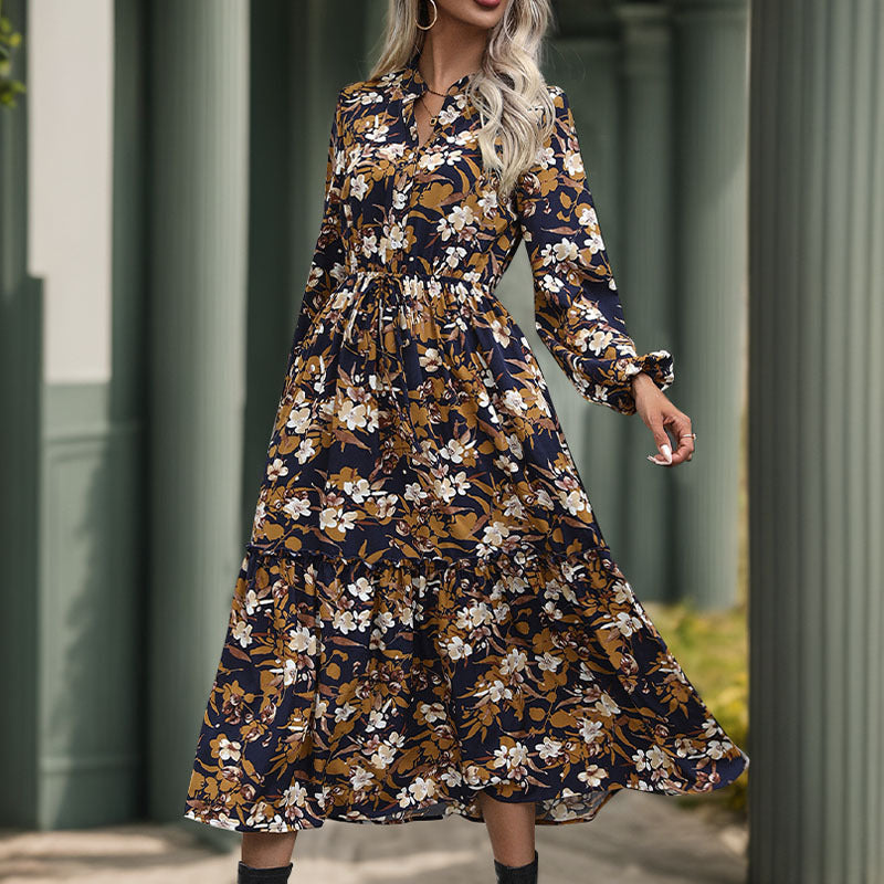 Women's midi dress with floral design and elegant waistline, size S