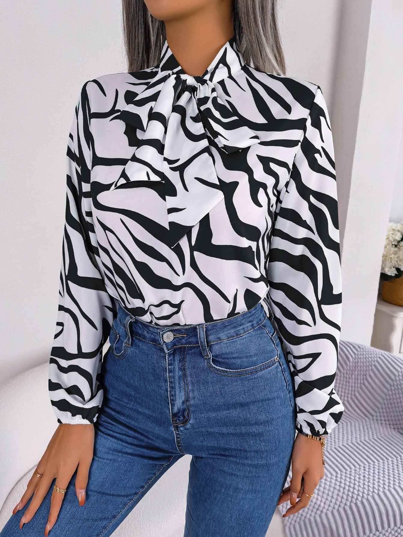 Women's blouse with fashionable zebra pattern and elegant bow collar, size
