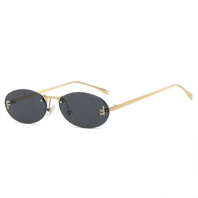 Valenzora | Oval sunglasses with golden accents and subtle stones