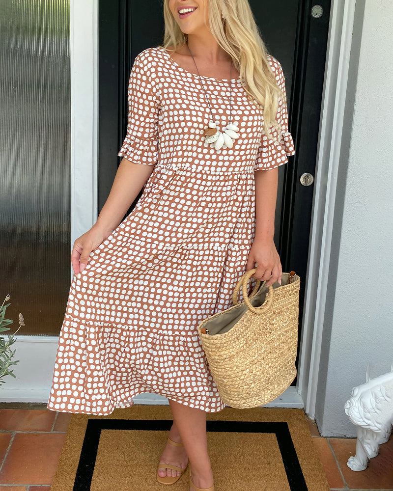 Midi dress with round neckline and polka dot print