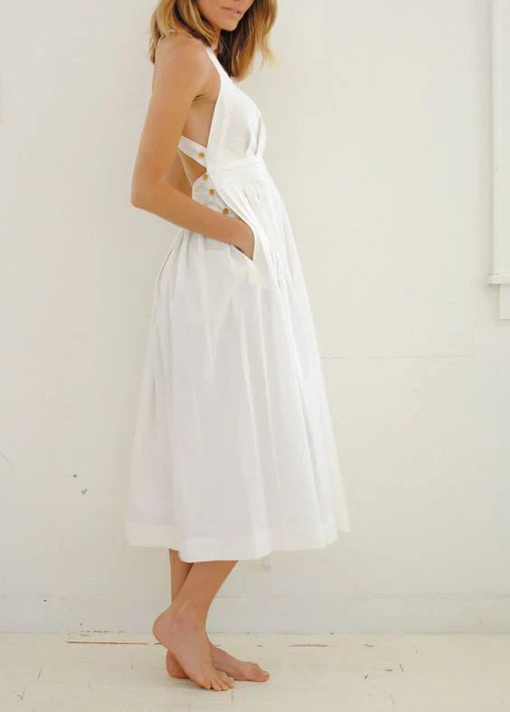 Valenzora | Backless, pleated dress with large pockets