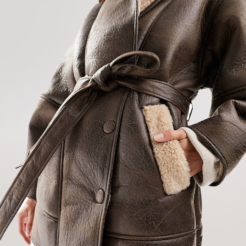 Valenzora | Sherpa-lined faux leather jacket with belt