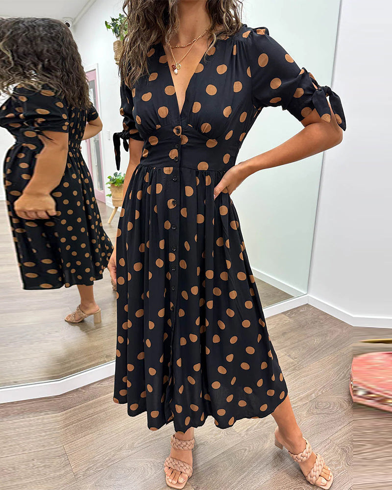 Dress with a deep V-neck and polka dots
