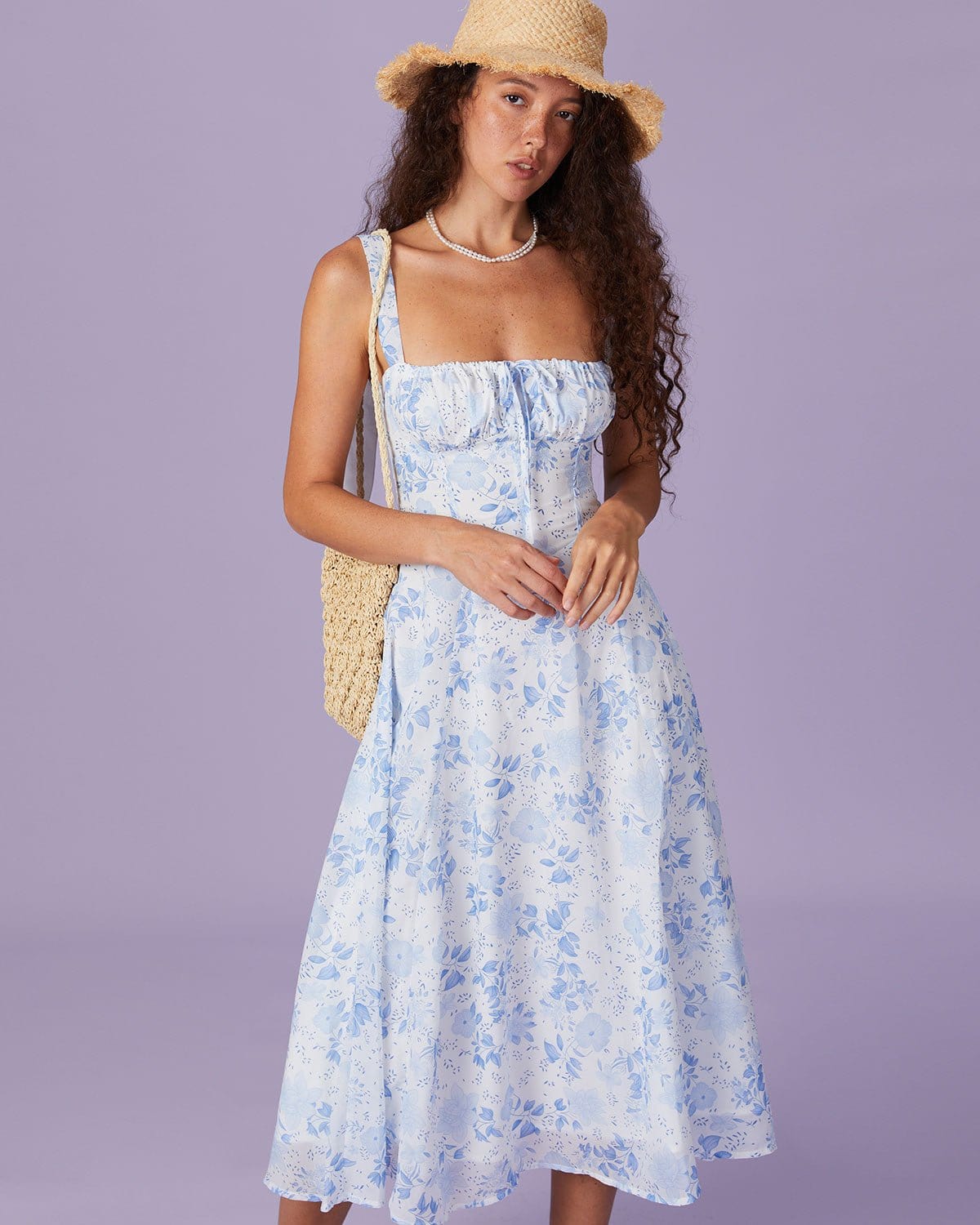 Blue midi dress with floral pattern and square neckline