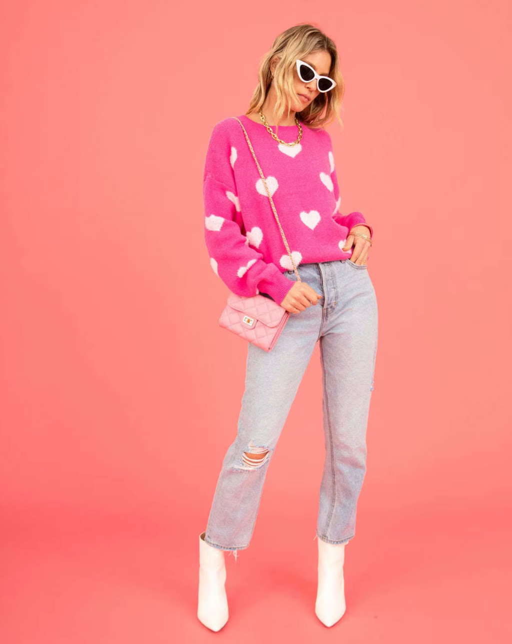 – Knitted sweater with heart print
